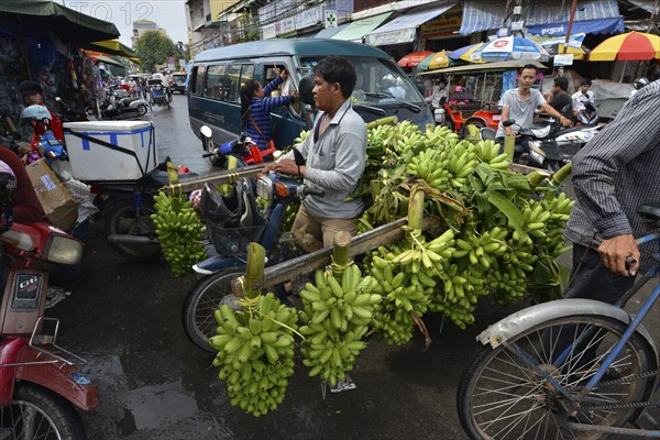 Banana seller with a moped