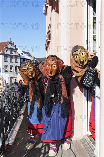 Three witches on the balcony of Gengenbach Town Hall