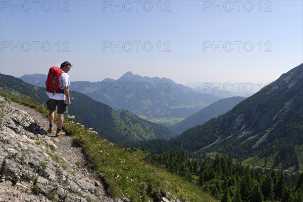 Hiker walking on the trail leading to Taubenstein mountain