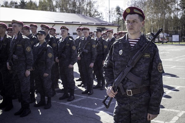 Swearing-in ceremony of volunteers after a three-week military training