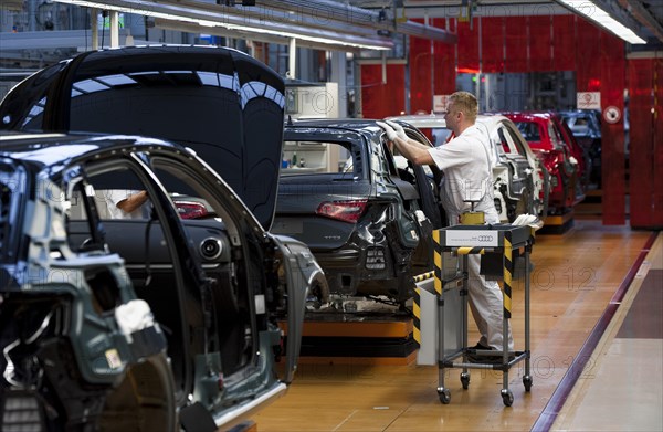 Man working on the production line of the Audi A3 at the Audi plant