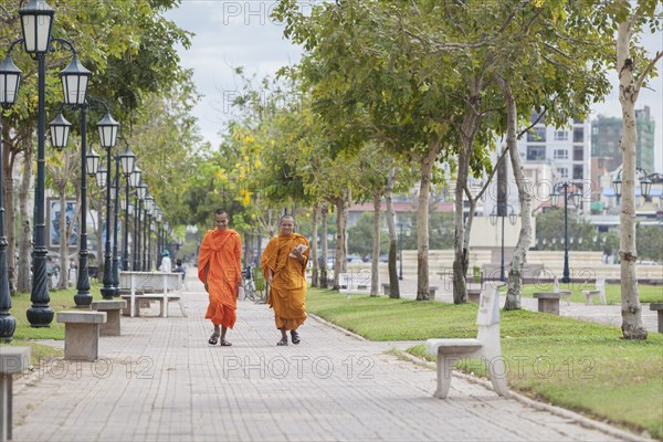 Buddhist monks walking in central Phnom Penh