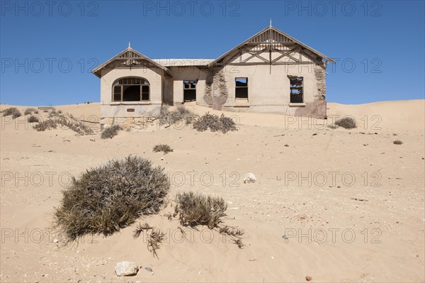 House of a former diamond miners settlement that is slowly covered by the sand of the Namib Desert