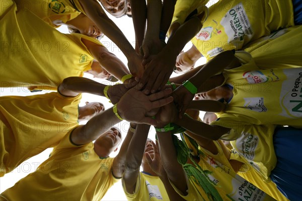 Soccer team motivating themselves in a circle before a game