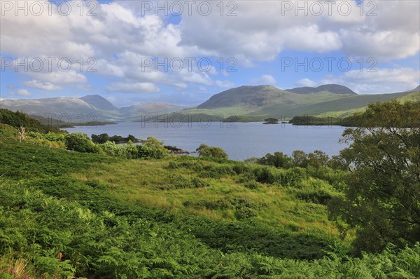 Clouds over the freshwater Loch Assynt