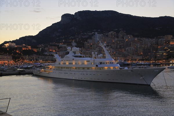 Motor yacht Atlantis II in the evening in Port Hercule