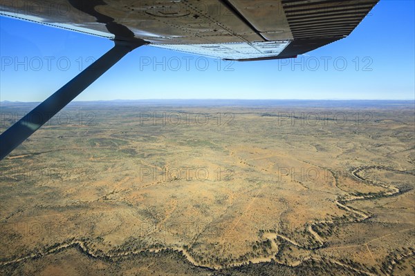 View from a small plane over the dry riverbed of Oanob River