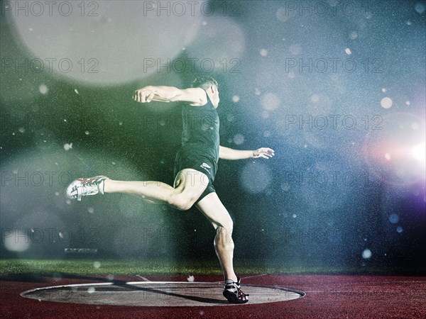 Discus thrower spinning before a throw