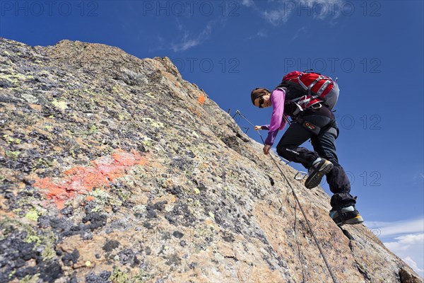 Mountain climber descending from Wilder Freiger Mountain