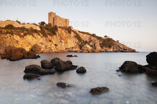 Etruscan castle of Talamone in the evening light