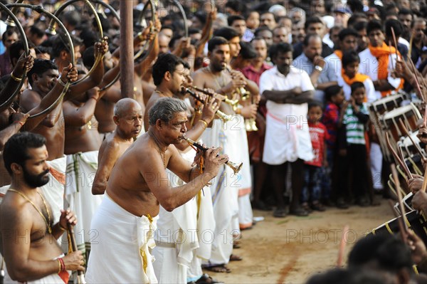 Musicians with trumpets at Hindu temple festival