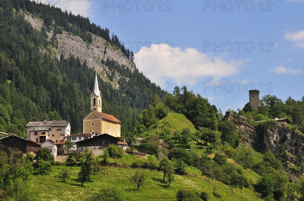 The village church of Trin and the ruins of the Canaschal Castle