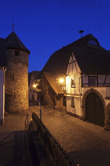 Historical Town Hall with a fortified wall and the tower of a fortified church
