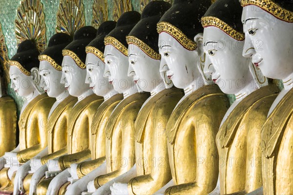 Many seated Buddha sculptures