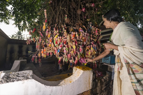 Woman putting down a flower