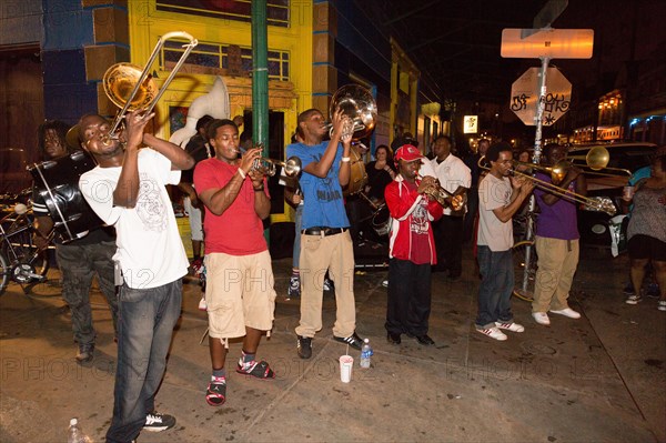 Teenagers with wind instrumets busking