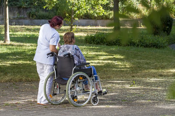 Woman sitting in wheelchair