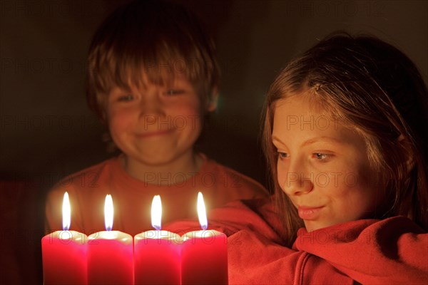 Children looking at Advent candles