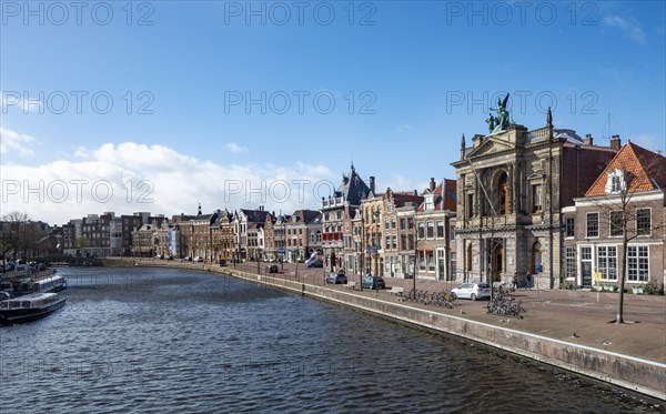 Gracht Spaarne with historic houses and Teylers Museum