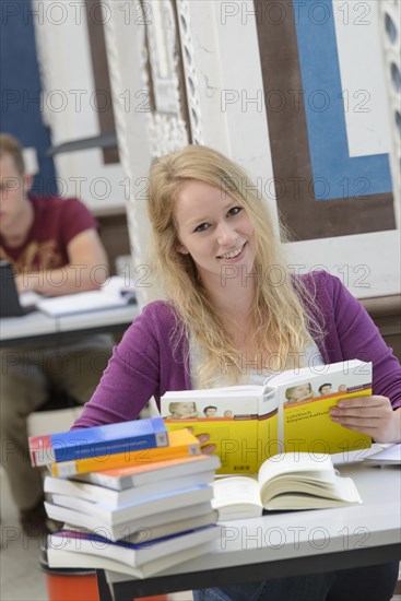 Student studying in the departmental library of the University of Hohenheim in Schloss Hohenheim Palace