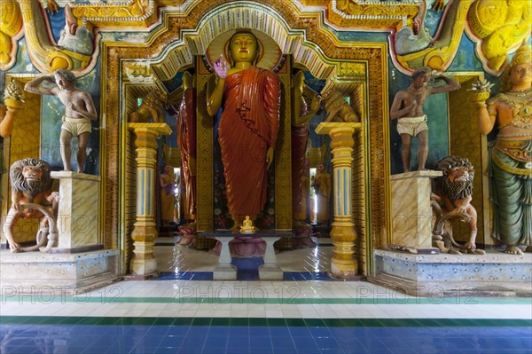 Statue in the old Buddhist temple complex of Sri Pushparama Maha Viharaya