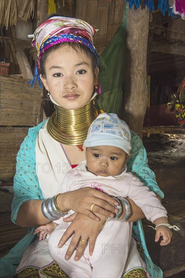 Long-necked woman with her baby