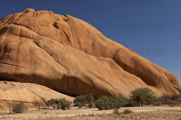 Landscape with rocks around the monadnock of Spitzkoppe Mountain