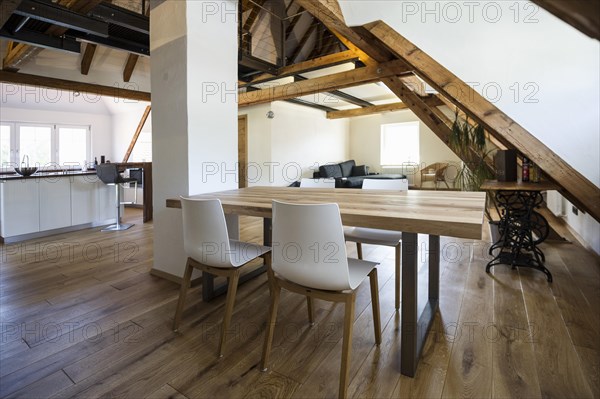 Converted loft with a living area and a modern kitchen