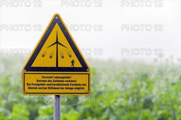 Sign warning against flying chunks of ice from a wind turbine