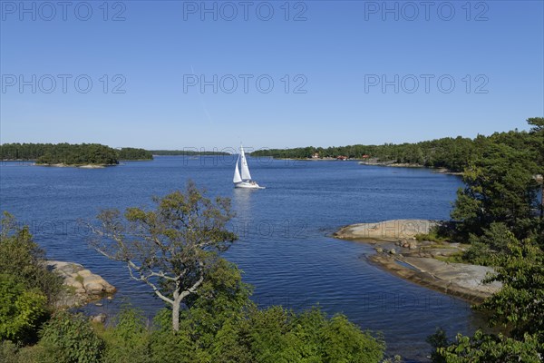 Sailboat and typical round polished rocks