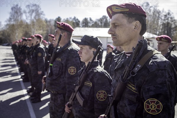 Swearing-in ceremony of volunteers after a three-week military training