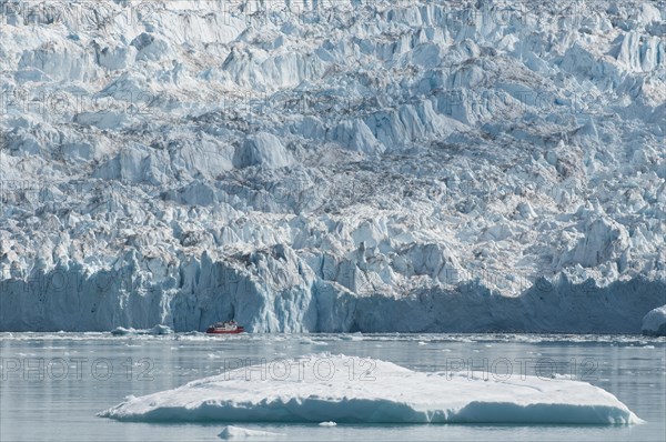 Ship in front of the Eqi Glacier