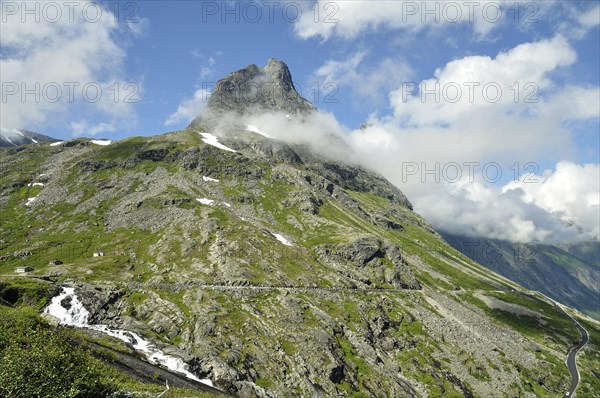 Bispen Mountain above the Trollstigen Road with the Stigfossen waterfall