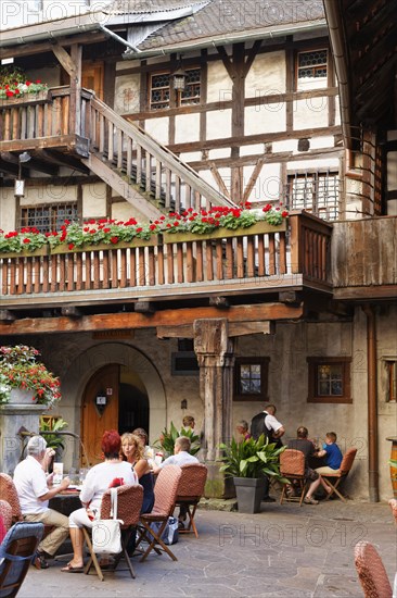 Courtyard of Schattenburg Castle with a restaurant