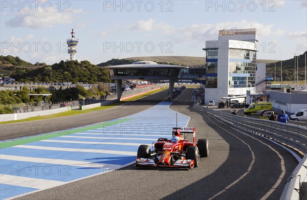 Fernando Alonso in the Ferrari F14 T in the pit lane exit