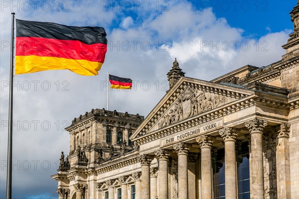 Reichstag building with German flags