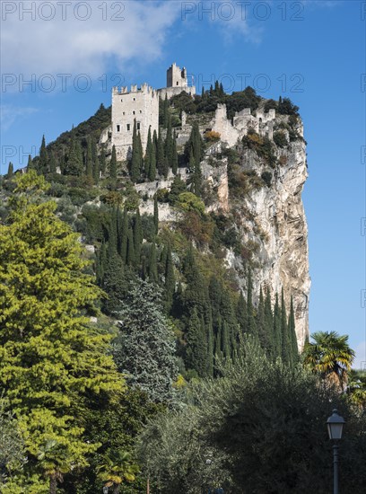 Mighty cliff with the ruins of Arco Castle or Castello di Arco above Arco