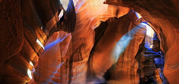 Rays of light falling on yellow-red sandstone formations