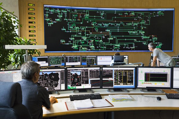 Shift supervisor Hans-Peter Polzer sitting at his work station in the Transmission Control Center