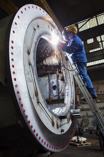 Welder working at Neunfelder Maschinenfabrik