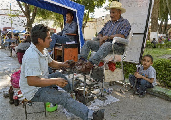 Shoeshine boy at work