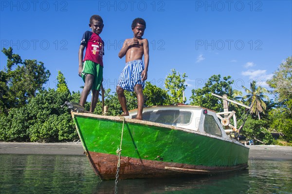 Local boys on a motorboat