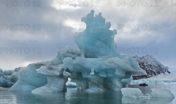 Iceberg tourists in a rubber dinghy