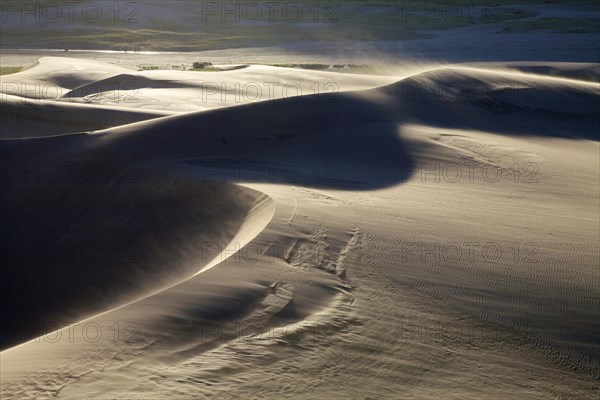 Sand blowing across the sand dunes