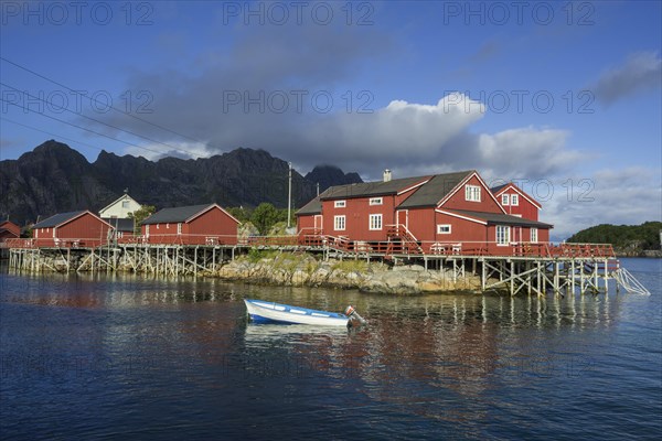 Rorbuer fishermen's cabins with a small motor boat
