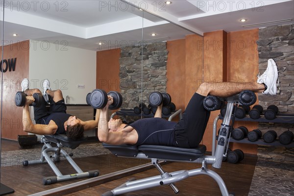 Man doing fitness exercises in a gym