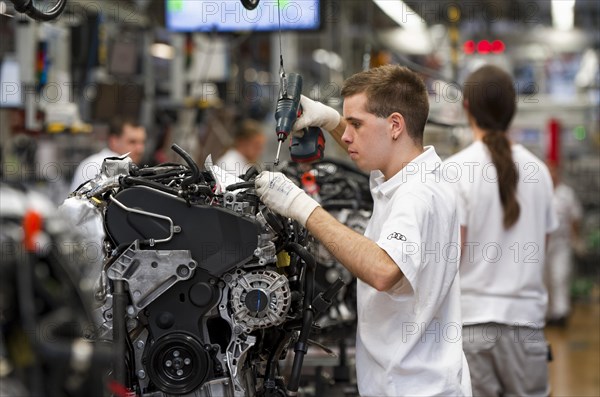 Man working on the production line of the Audi A3 at the Audi plant