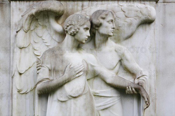 Angel and a female figure on a gravestone