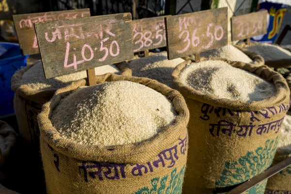 Rice in different qualities for sale in bags at an open air market