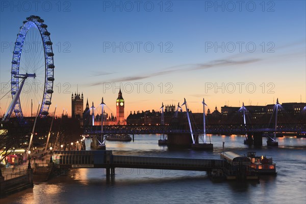 View of the River Thames with the London Eye and the Houses of Parliament at dusk